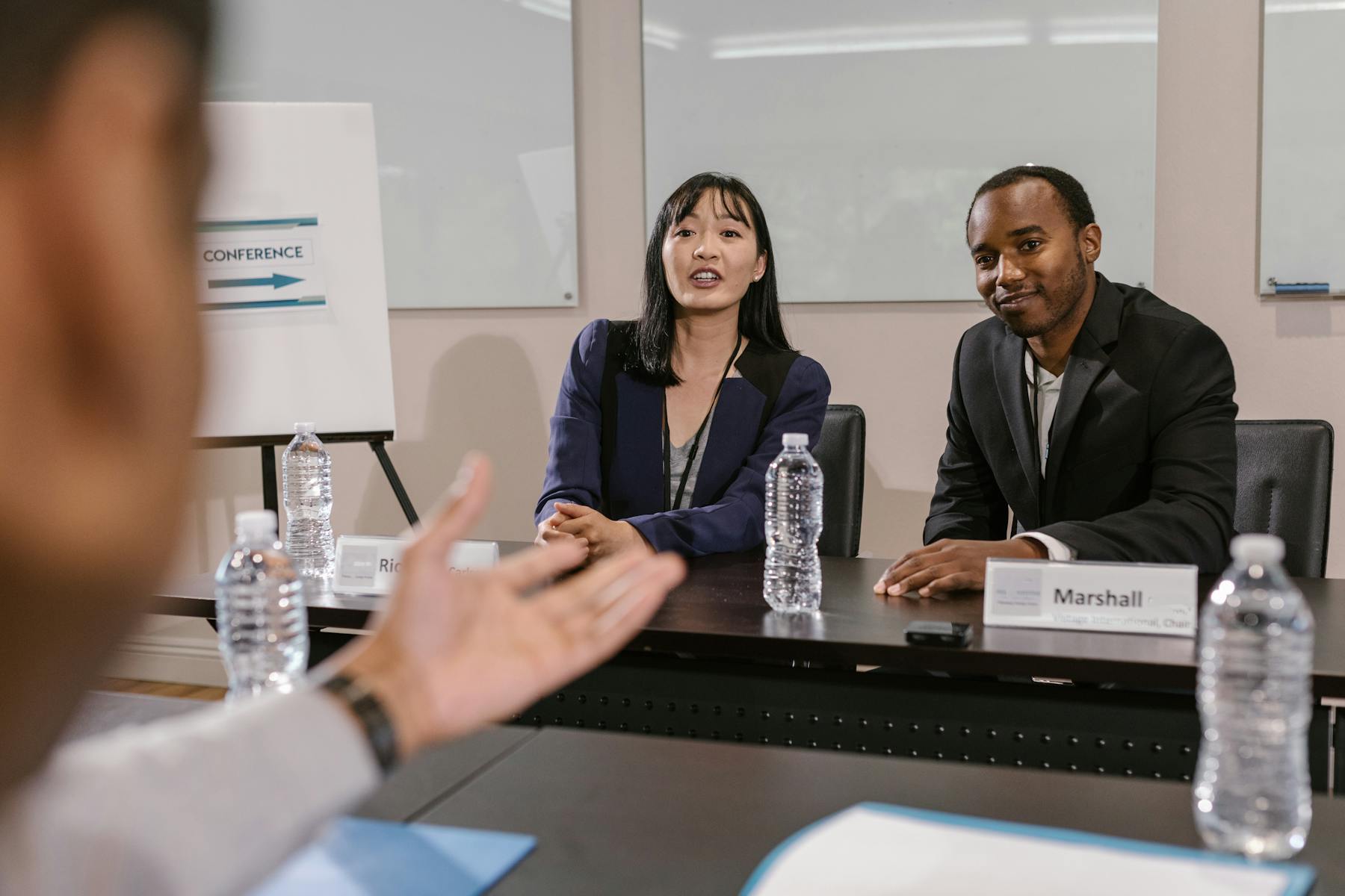 Executives discussing targeted hiring strategy in a meeting